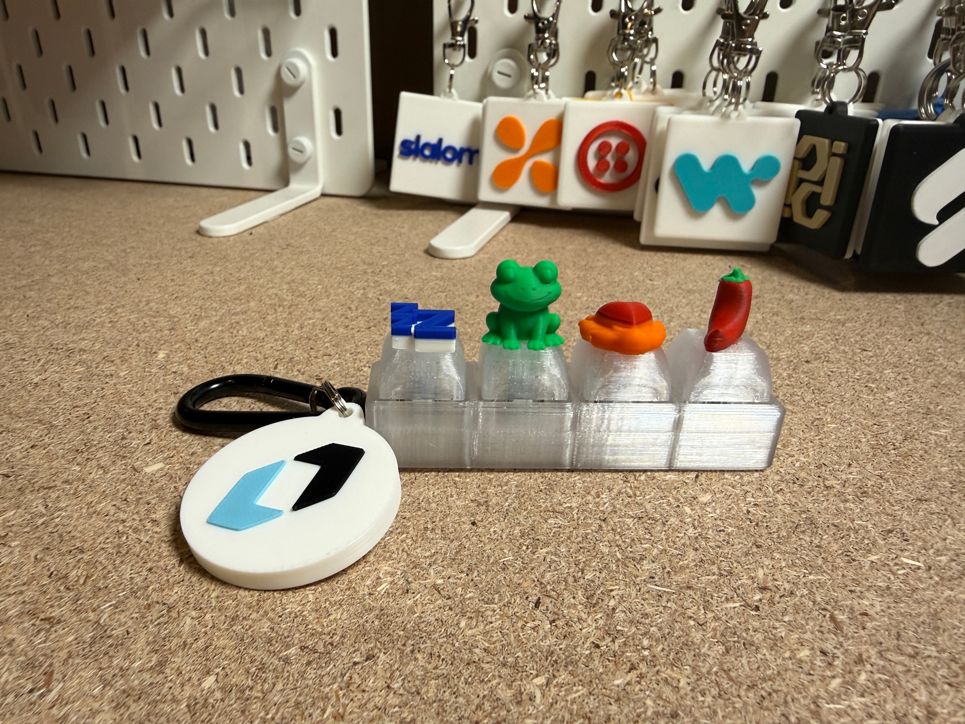 Fidget clicker activation with custom logo toppers, shown with branded keychains.Fidget Clicker Activation
