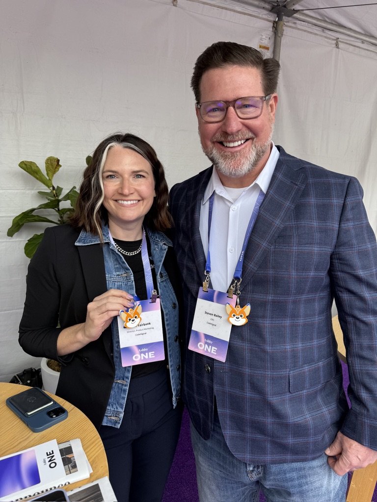 Custom 3D printed branded swag by The Bear Bar — portfolio example 111: CodeSignal team at the Ashby One conference, wearing their custom NFC keychains linked to their LinkedIn profiles.